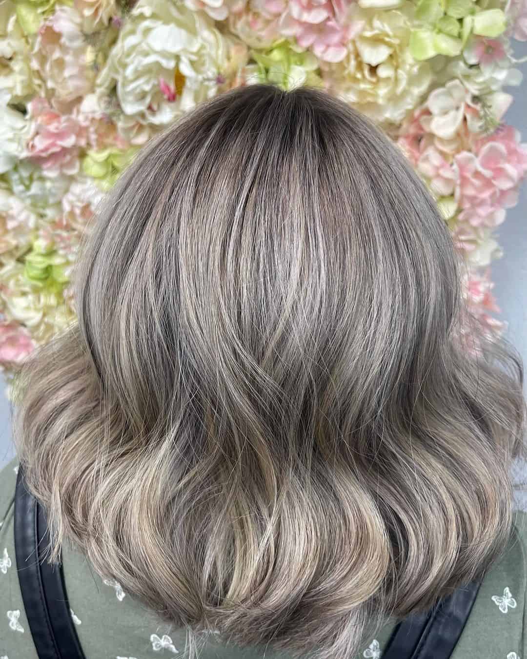 Wavy & Elegant Ash Blonde Highlights On Black Hair
