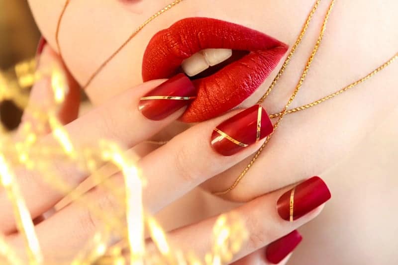 Square Shaped Dark Red Nails With Gold Lines