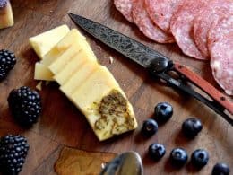 CHEESE, CHEAP WINE, AND TATTOOED KNIVES