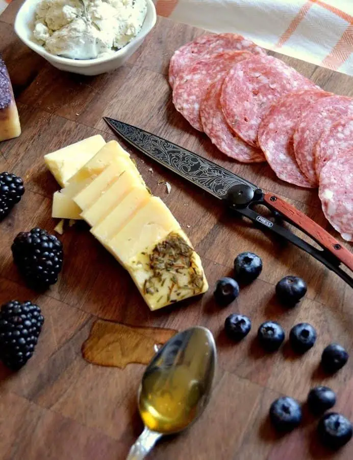 CHEESE, CHEAP WINE, AND TATTOOED KNIVES