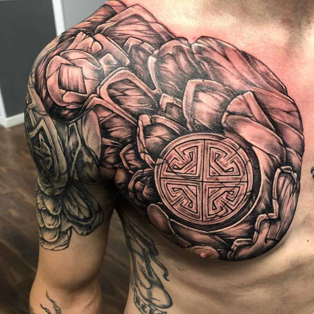 Norse Mythology Inspired Tattoo Over Chest And Shoulder