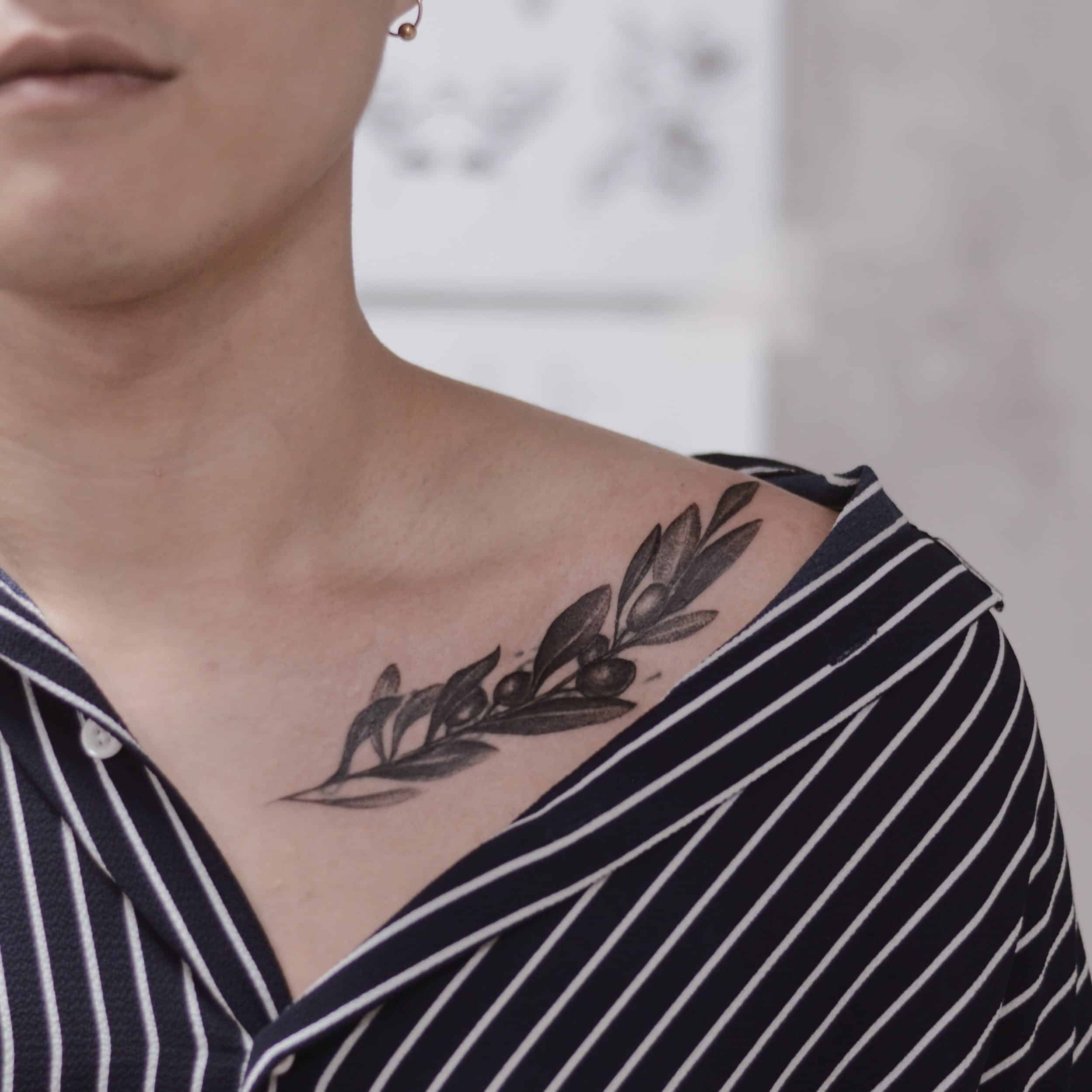 30+ Best Olive Branch Tattoo Design Ideas (2022 Updated!) 26 Black Olive Branch Collarbone Piece