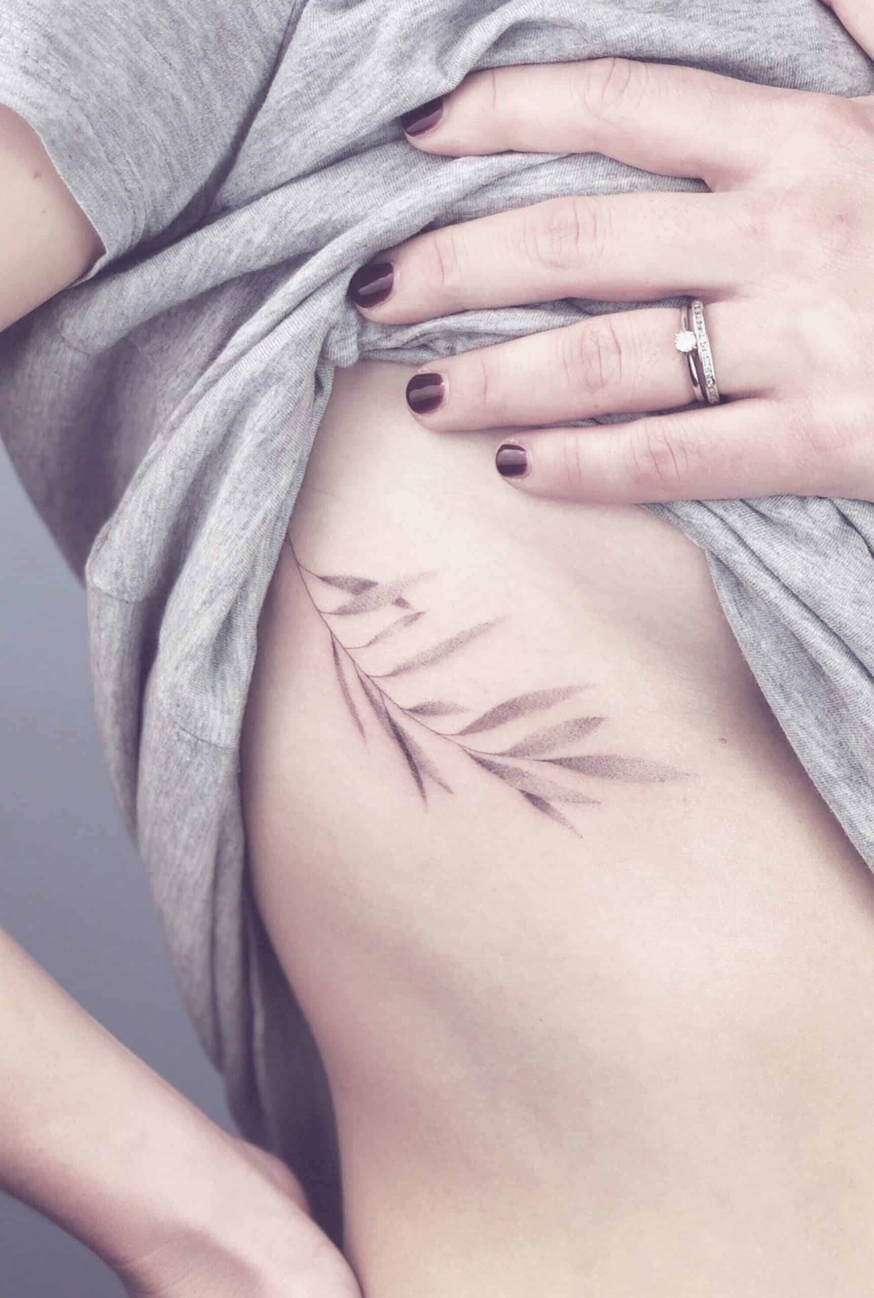 30+ Best Olive Branch Tattoo Design Ideas (2022 Updated!) 24 Side Chest & Stomach Olive Branch