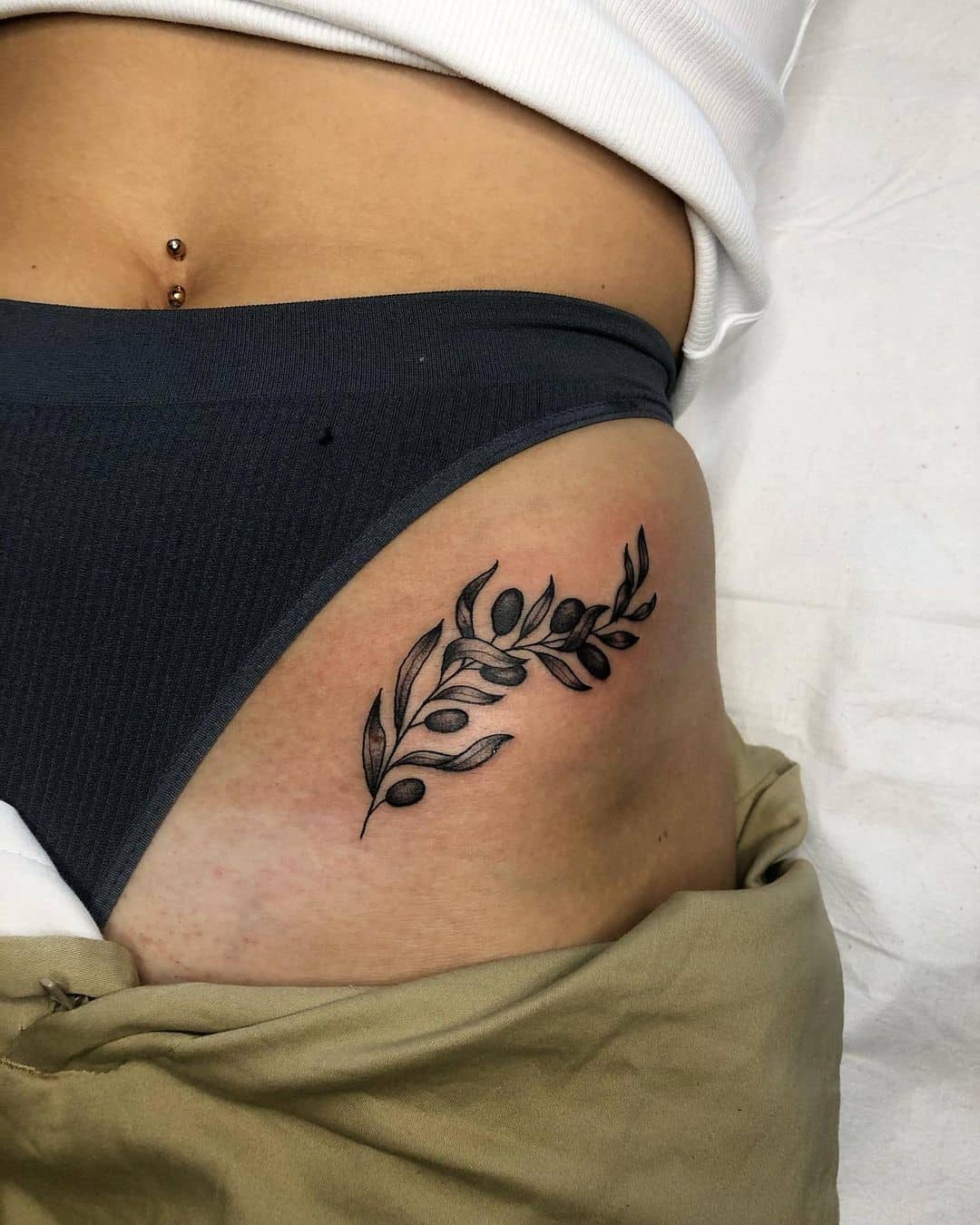 30+ Best Olive Branch Tattoo Design Ideas (2022 Updated!) 22 Thigh Black Branch Olive Tattoo