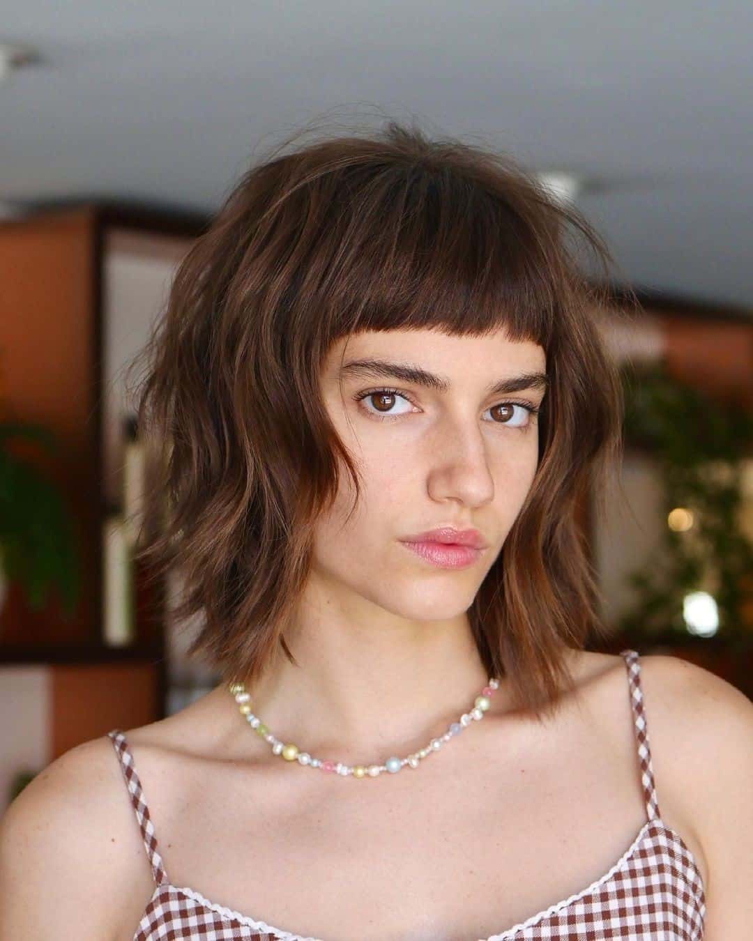 Fringe Bangs Short Hairstyle For Women With Round Faces