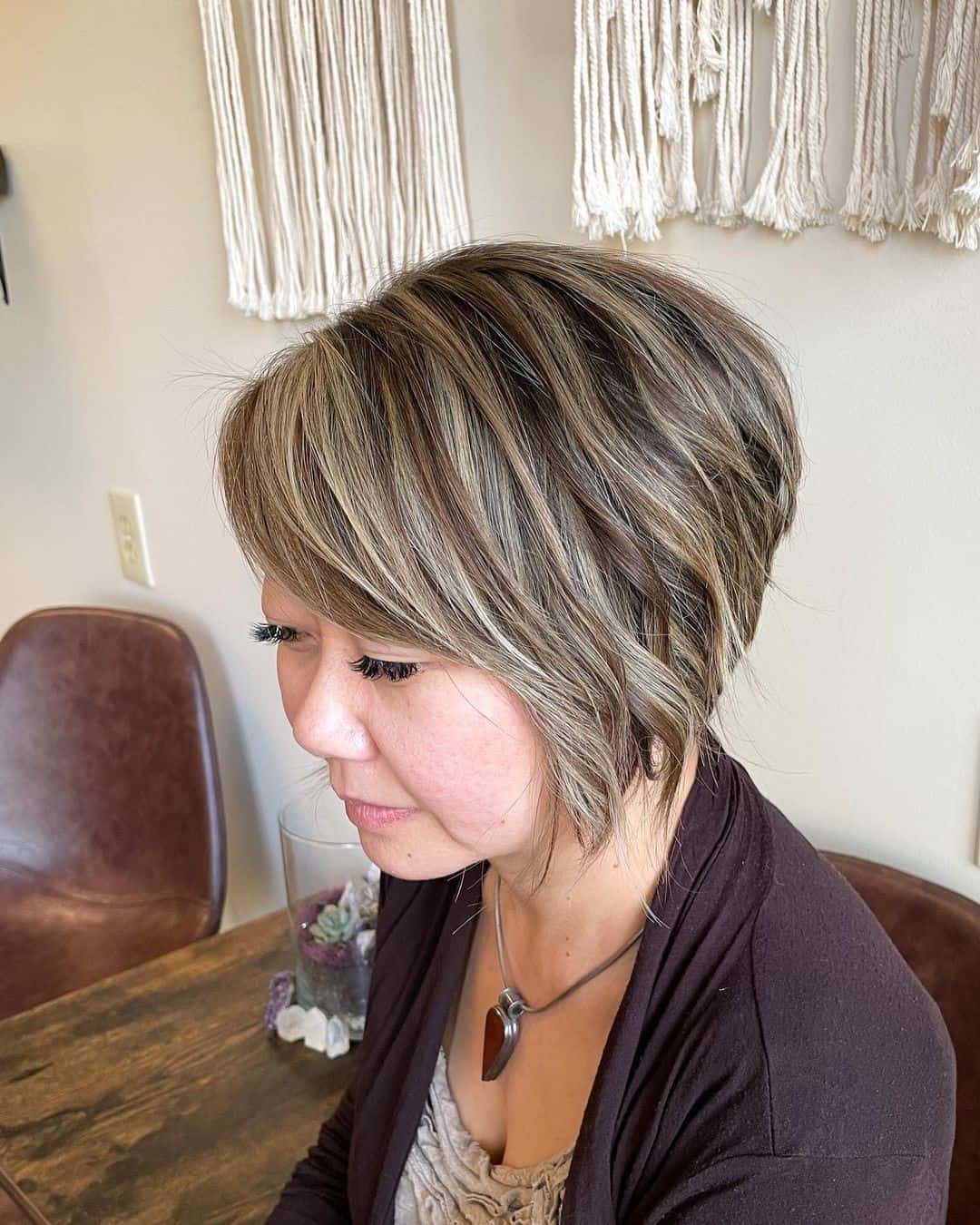 Highlighted Short Voluminous Side Swept Pixie For Slim Faces