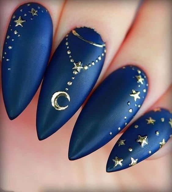 Oval Shaped Navy Blue Nails With Golden Jewellery