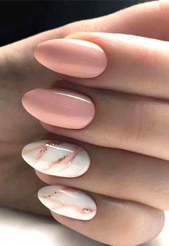 Oval Shaped Nude Nails With Marble Details