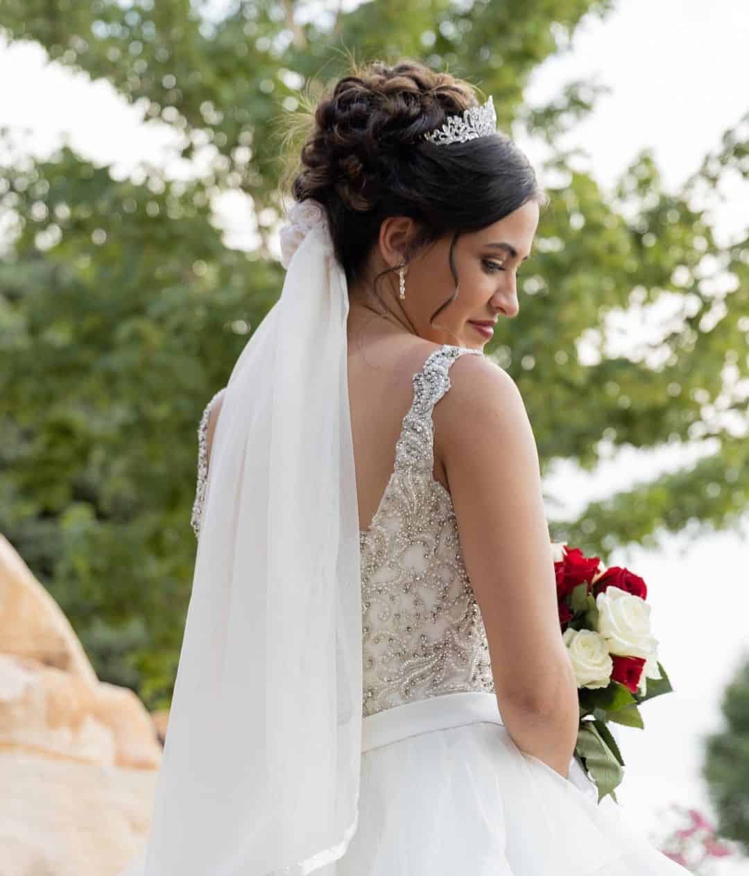 Bun Wedding Hairstyle With Veil And A Crown