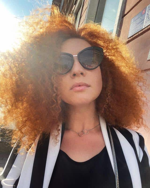 70+ Bold Dark Red Hair Styles: Latest Trends To Rock In 2022 34 Curly Dark Red Hair 2