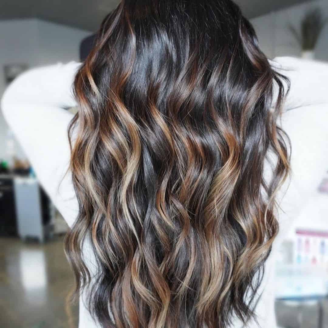 Full & Voluminous Caramel Highlights On Black Hair