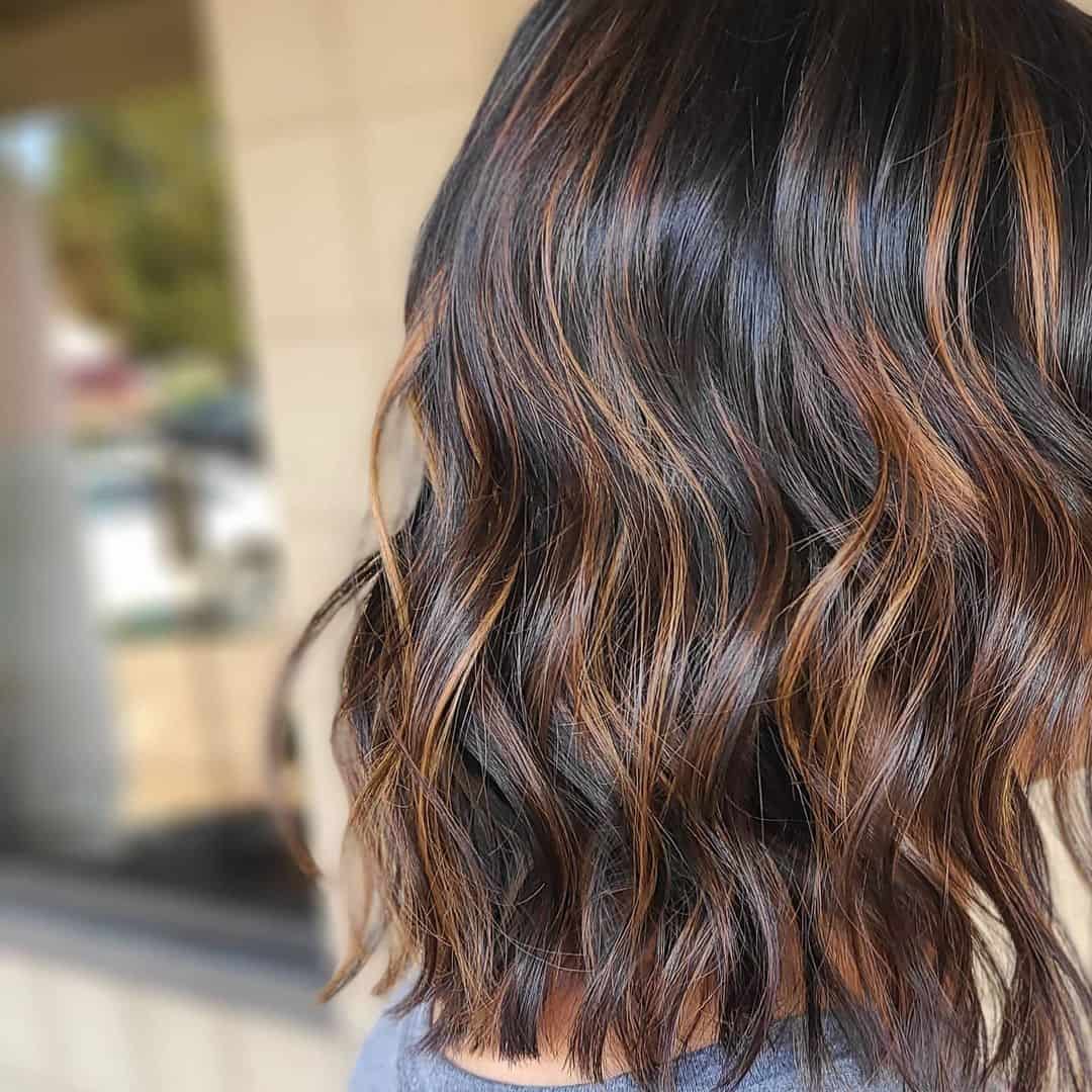 Gorgeous & Wavy Caramel Highlights On Black Hair