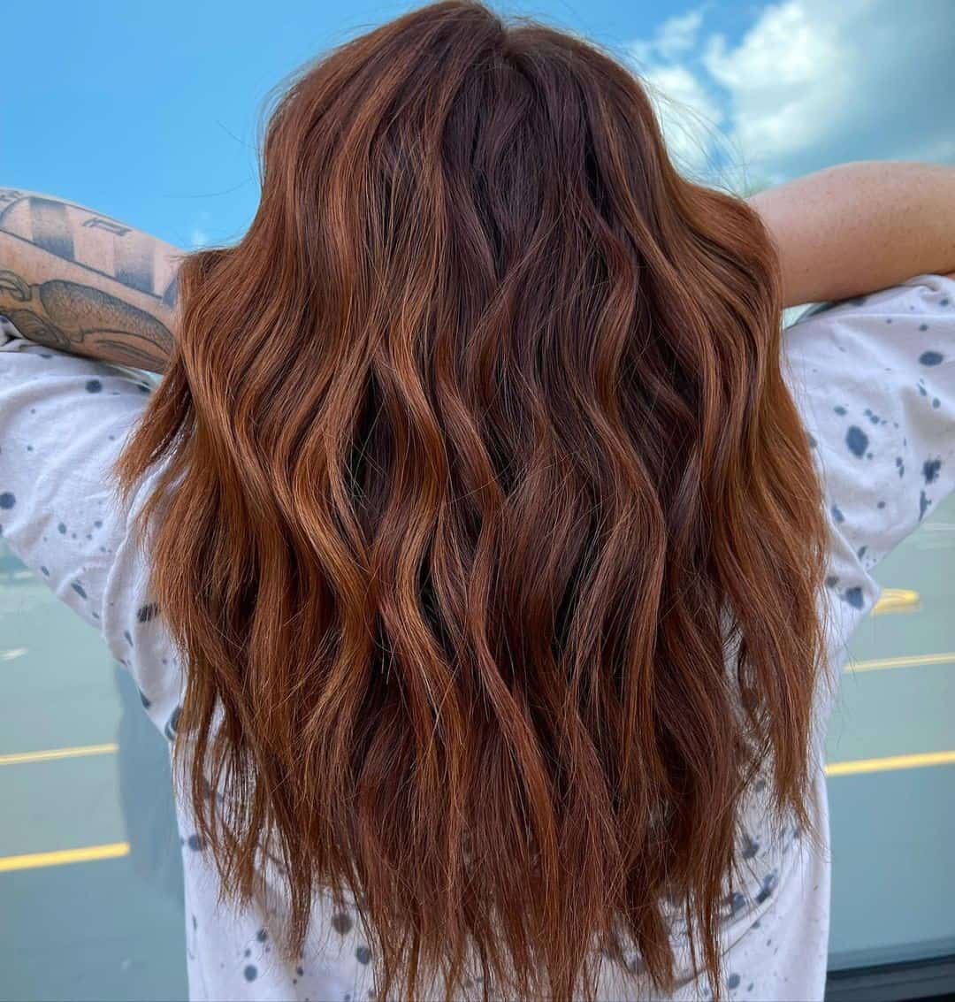 Long & Feminine Copper Red Highlights On Brown Hair 