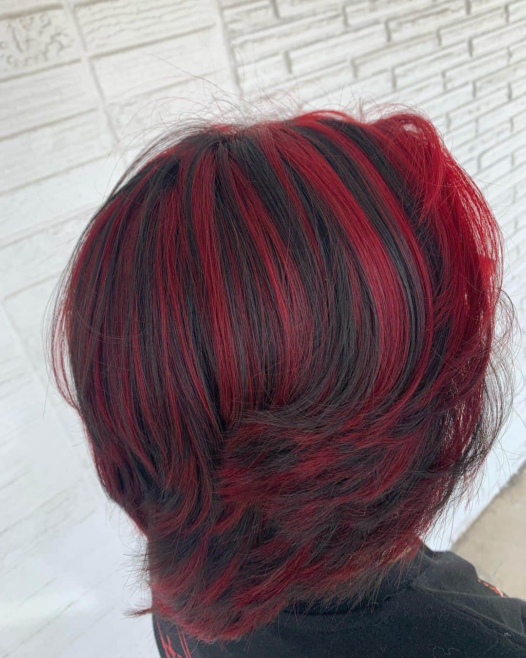 Loose Cut Red Highlights On Black Hair