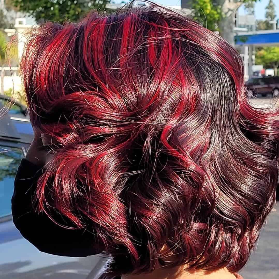 Red Highlights On Black Hair Wavy Loose Look 