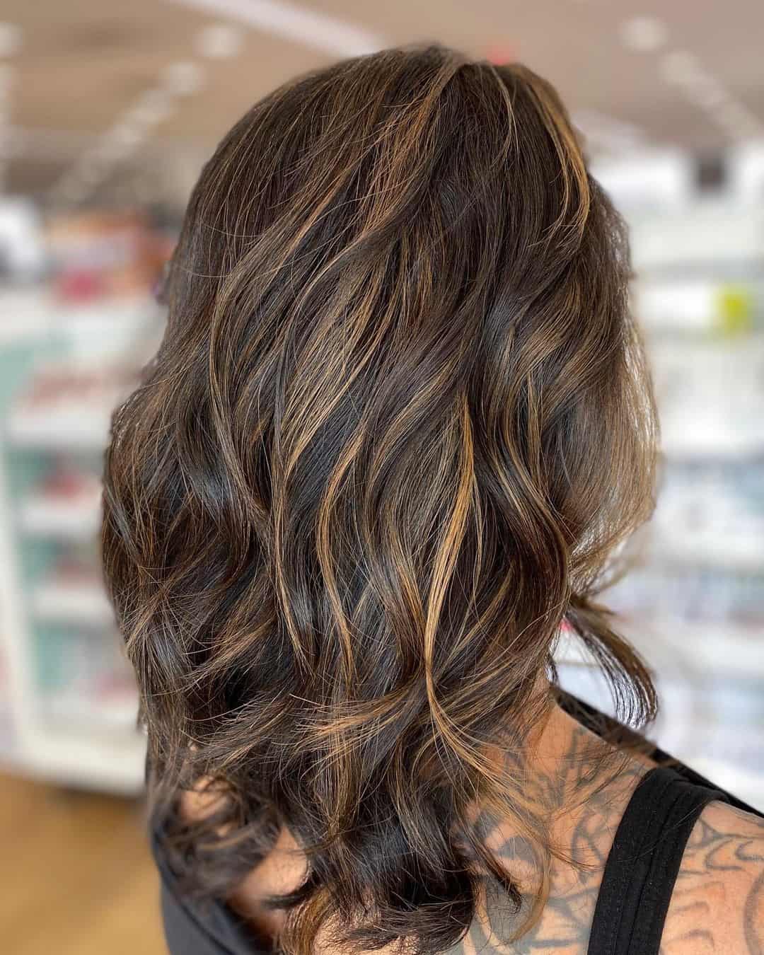 Voluminous Caramel Highlights On Black Hair