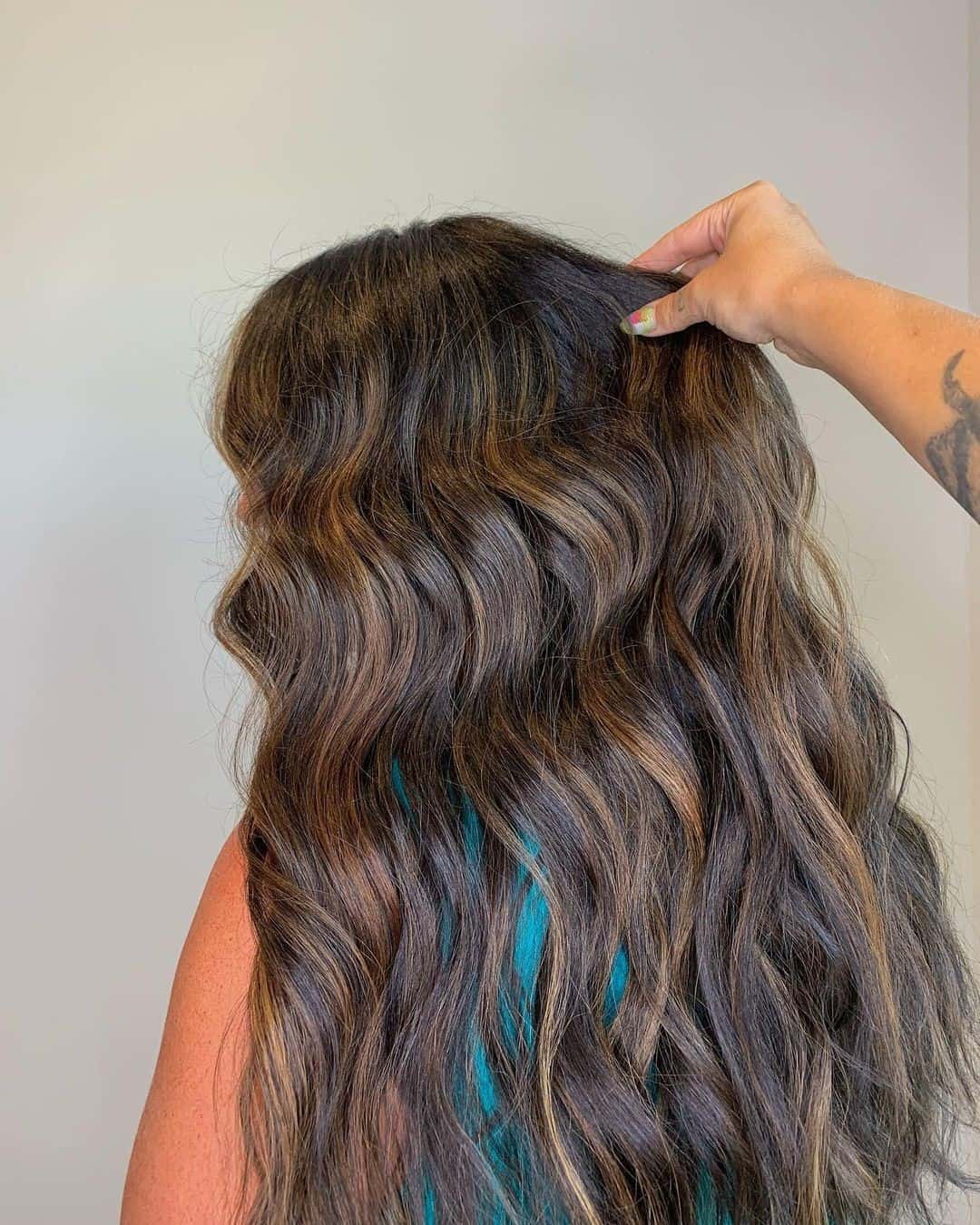 Wavy Hair Layered Caramel Highlights On Black Hair