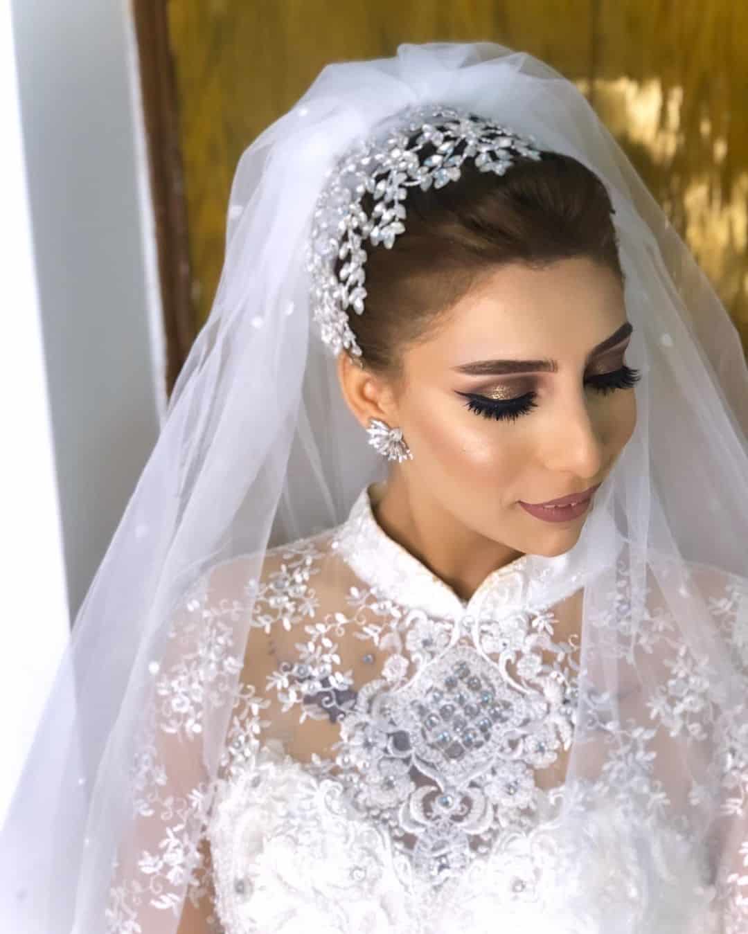Wedding Hairstyle With Veil And A White Crown 