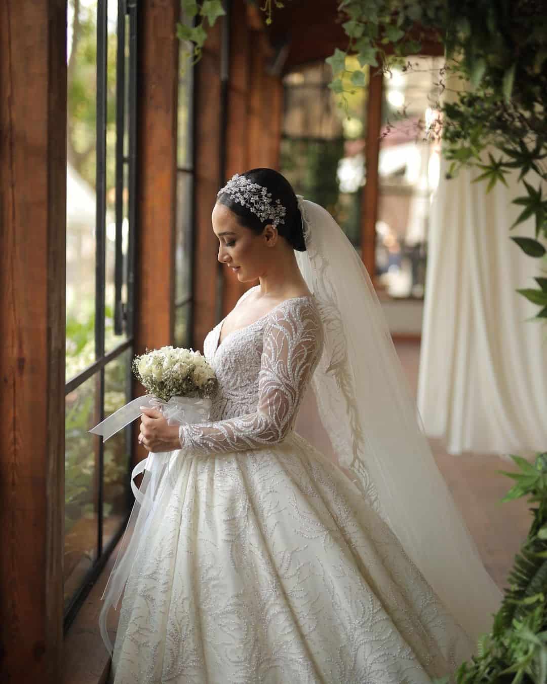 Brown Updo Hair Look With A Tiara For A Round Face