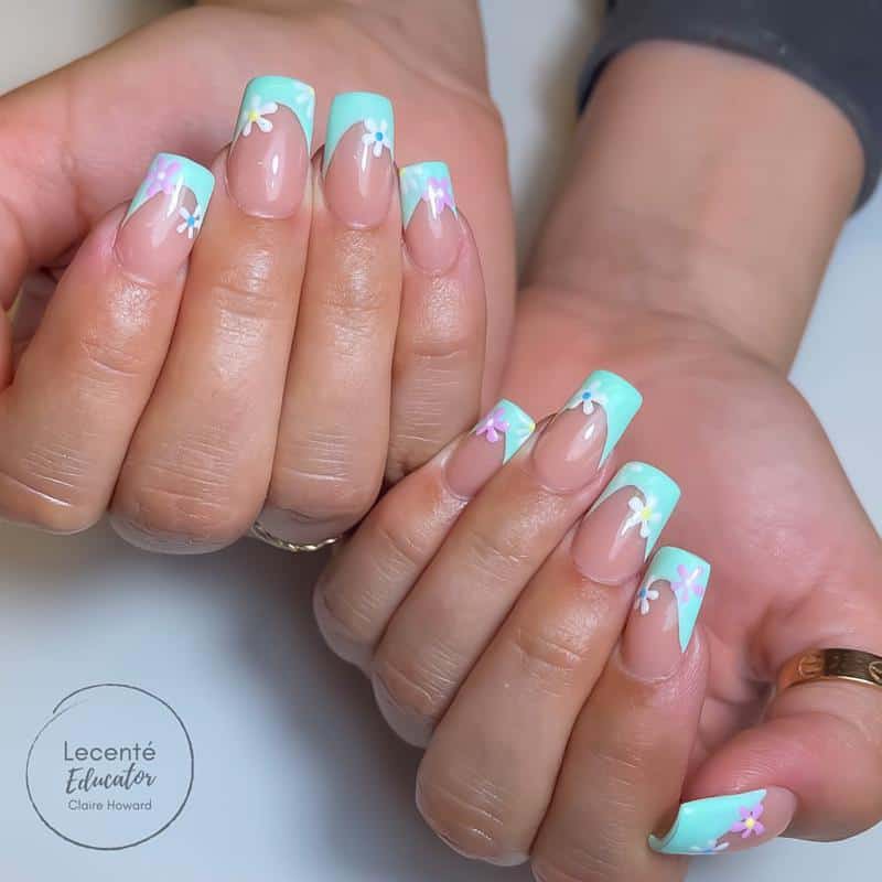 60 Elegant French Tip Nail For A Super Trendy Manicure (2023 Update) 38 Floral French Nail Tip 2