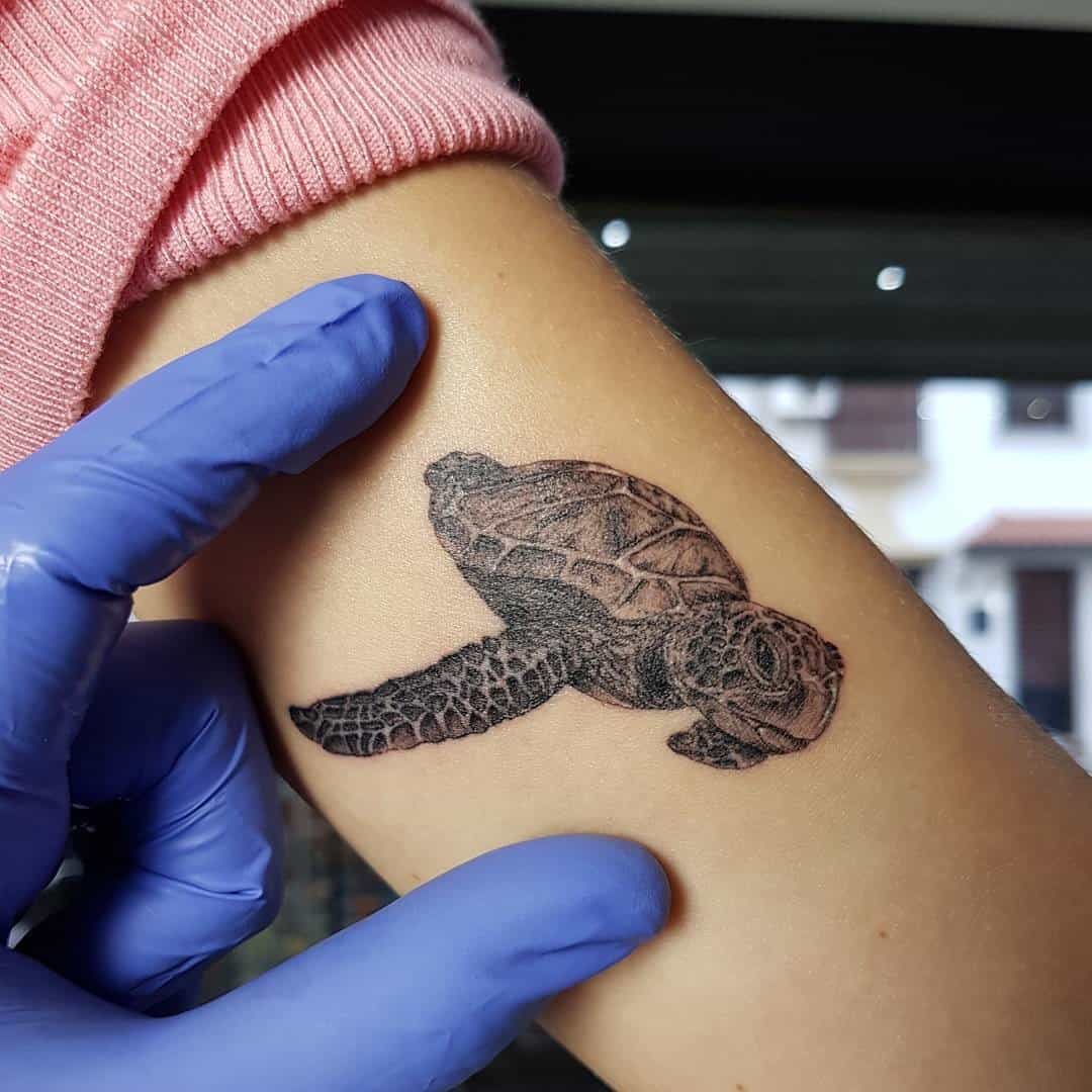 Realistic Small Sea Turtle Tattoo 