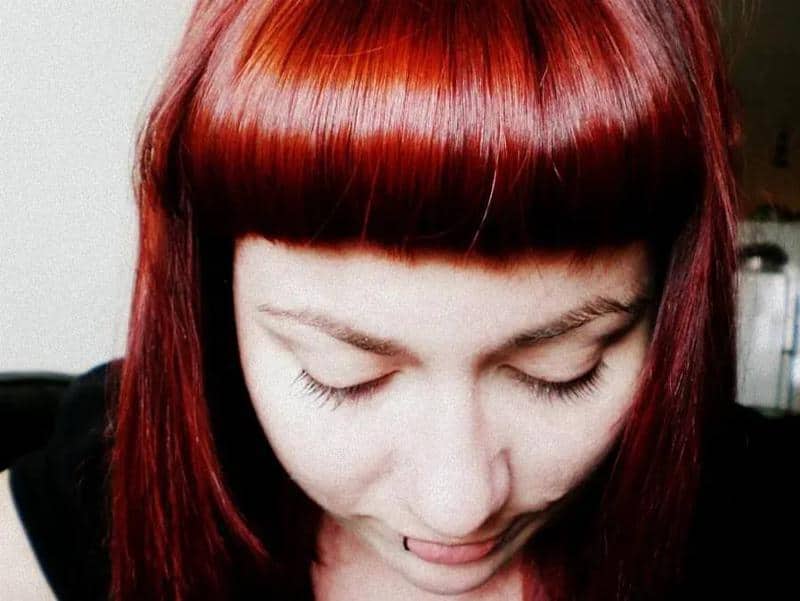 Hair Color Chart: Matching Hair Colors to Your Skin Tone (2023 Update) 21 Scarlet Red Hair