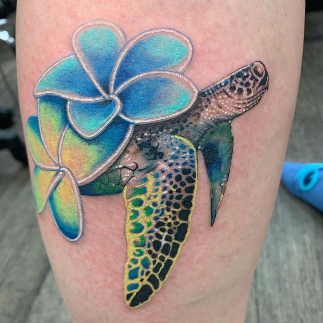 Sea Turtle Tattoo With A Flower 