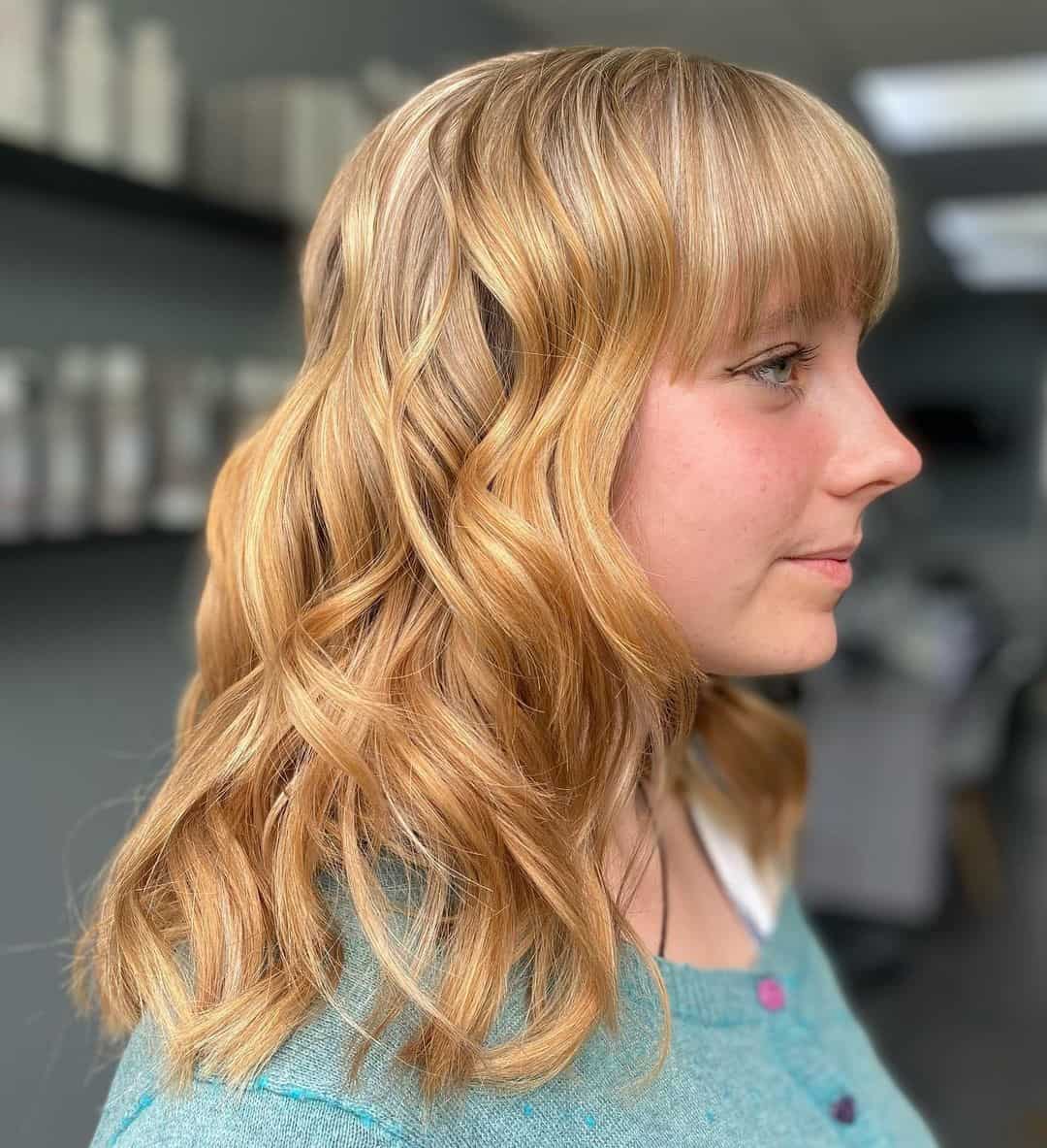 Top 32 Unique Fringe Hairdos for Women: Different Hair Length And Colors (2023 Update) 22 Wavy Blonde Fringe Hairstyles