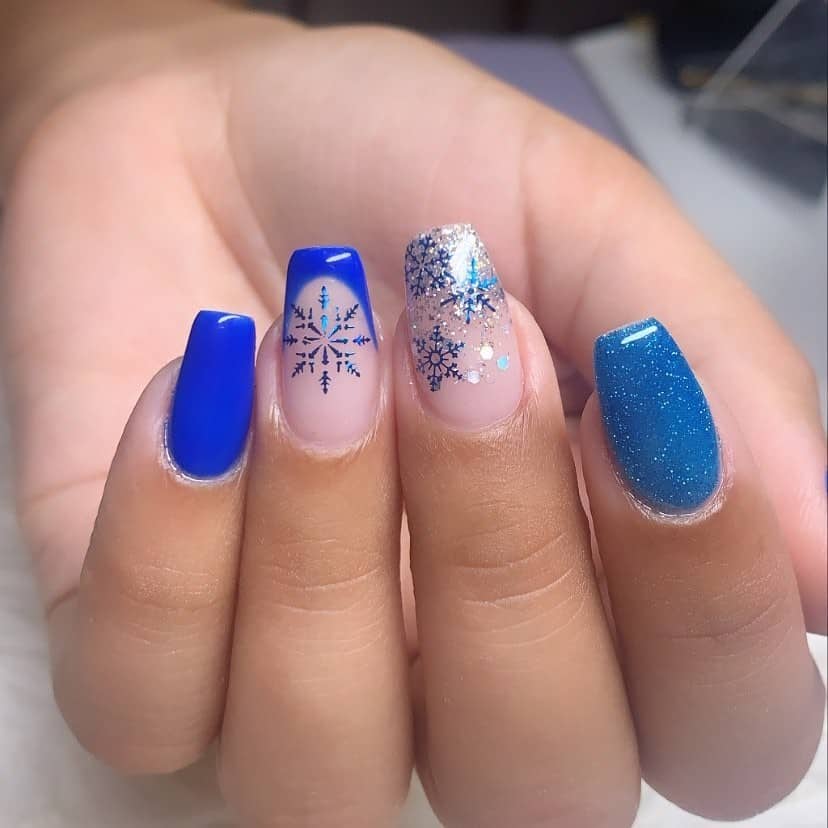 Top 33 Sweet Snowflake Nail Design Ideas For Winter 11 Blue Nails With A Snowflake Detail