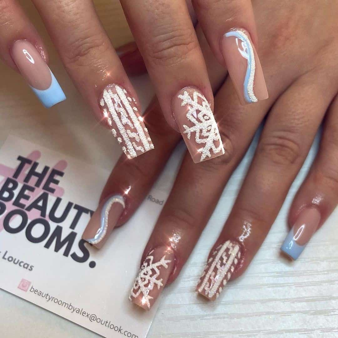 Top 33 Sweet Snowflake Nail Design Ideas For Winter 32 Coffin Manicure Nude & Blue Duo