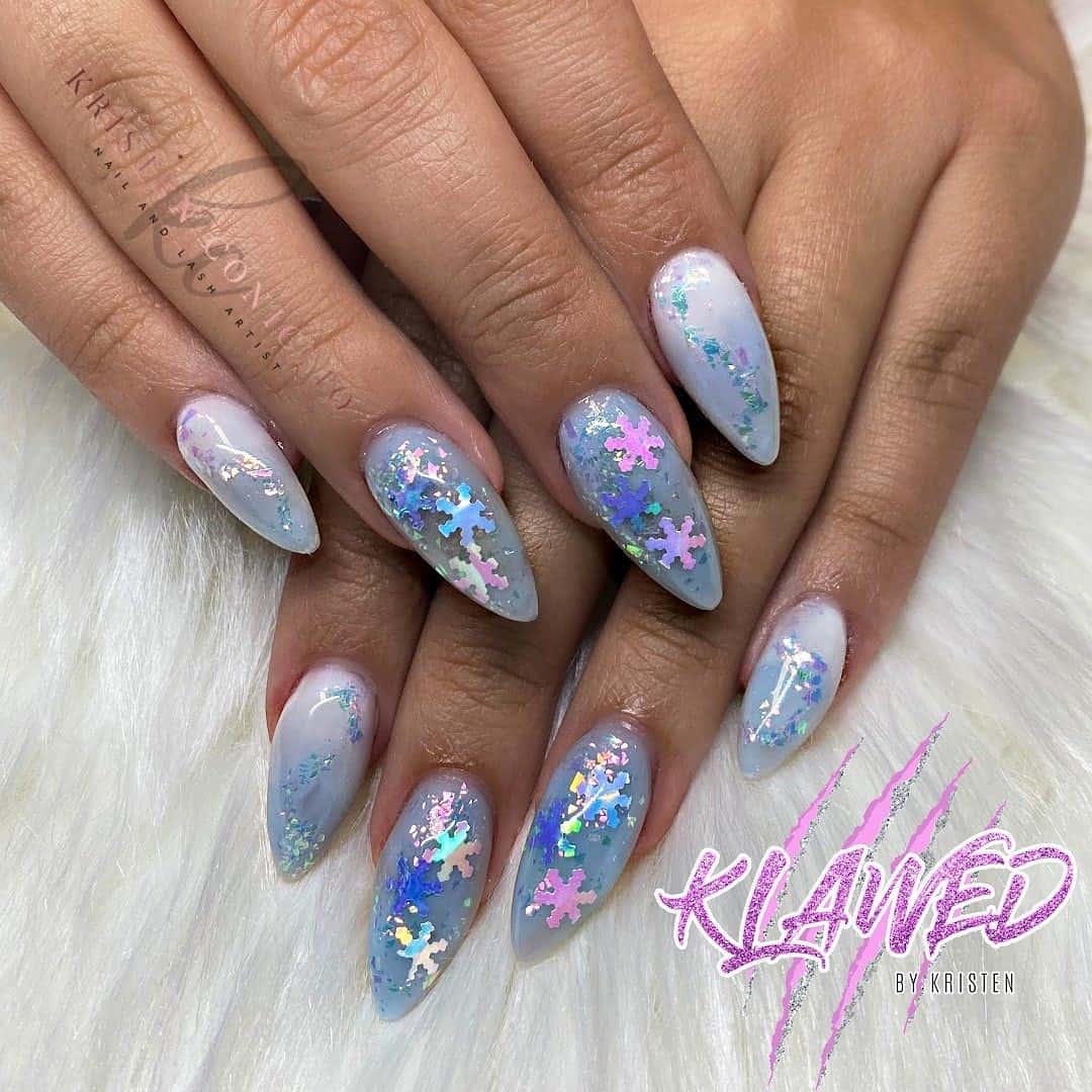 Light Blue Oval Manicure With Stars