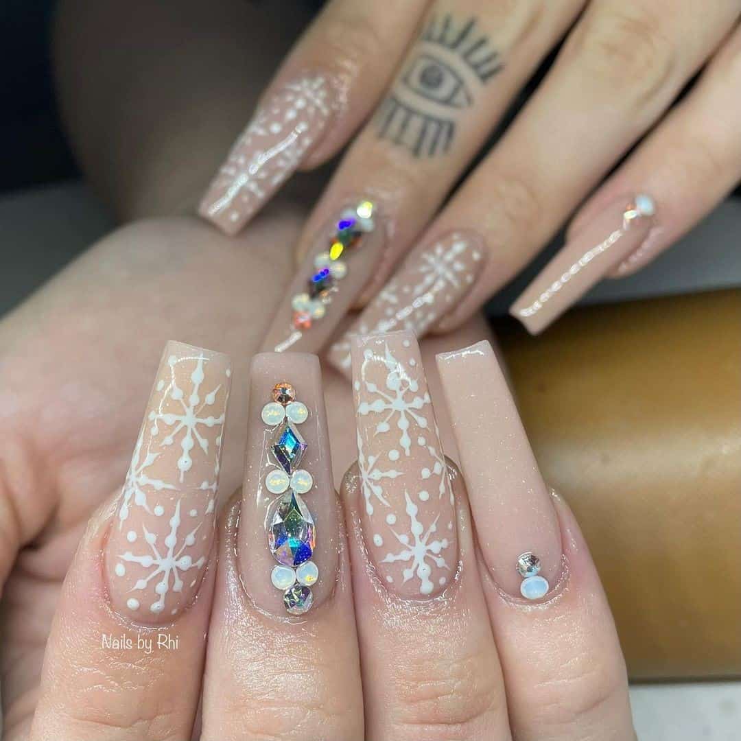 Modern Long & Nude Snowflake Nail Designs