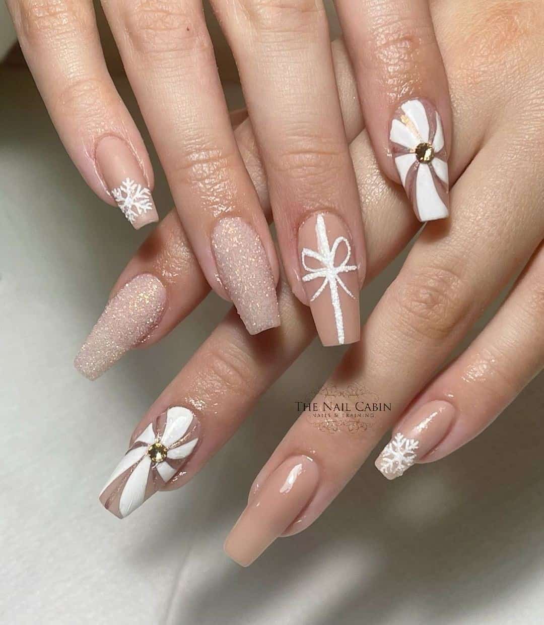 White & Nude Snowflake Nail Design